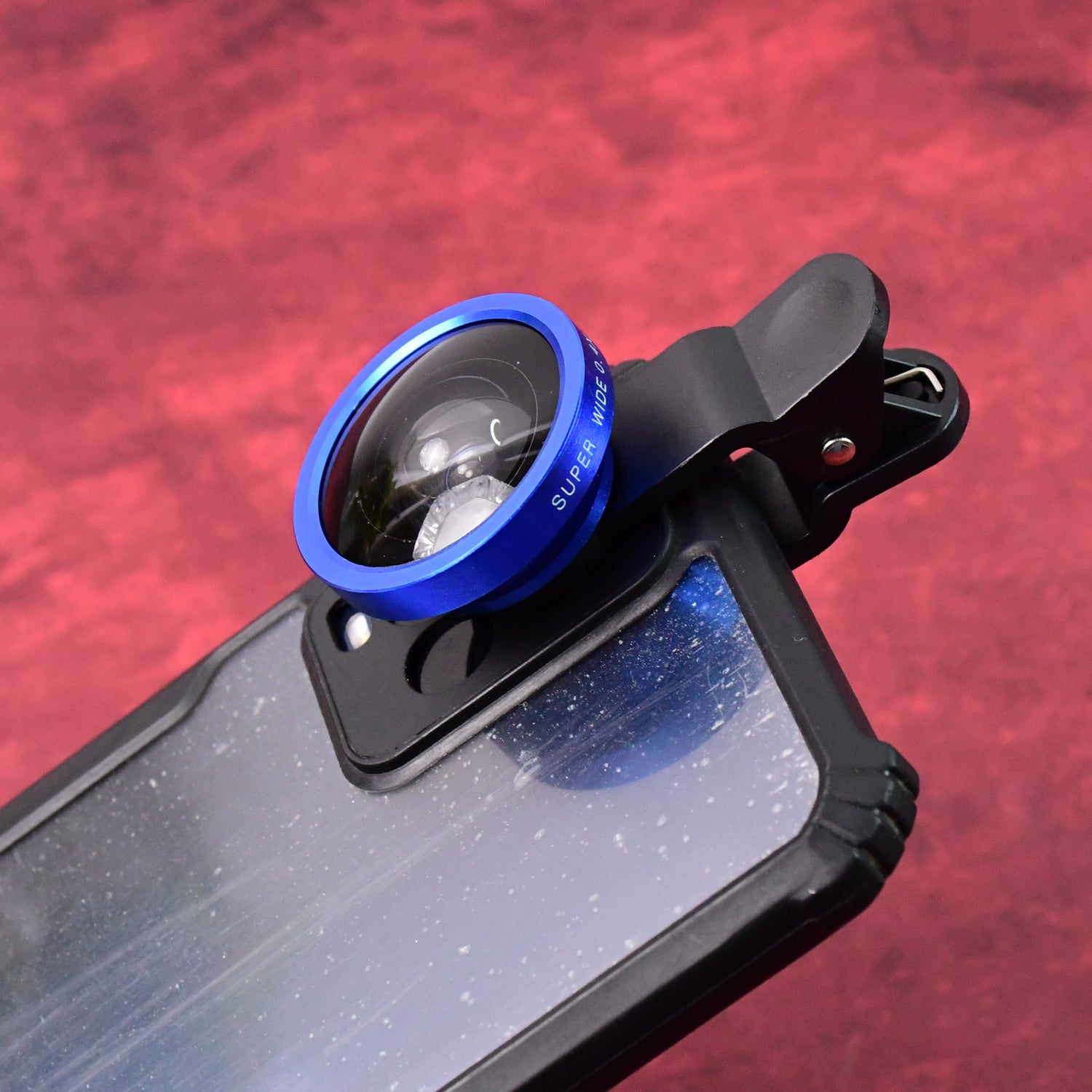 Wukusy universal clip-on selfie camera lens set attached to a smartphone for enhanced photo quality and wide-angle shots.