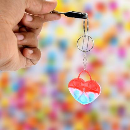 Wukusy Compact Silicone Pop It keychain toy with mixed bubble designs, portable stress relief fidget toy for kids.