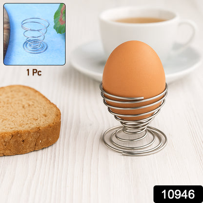 Stainless steel spring egg cup holder by Wukusy, designed for holding a boiled egg securely in a modern kitchen setting.