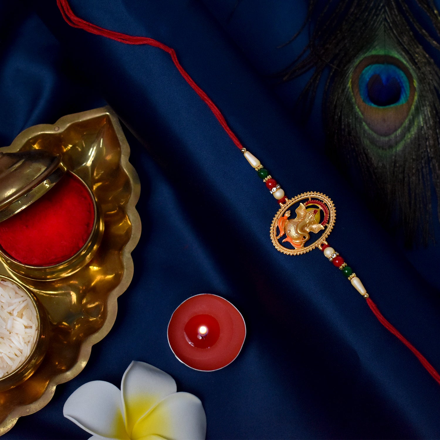 Elegant Ganesha designer Rakhi from Wukusy, featuring intricate fashion design with festive decorative elements.