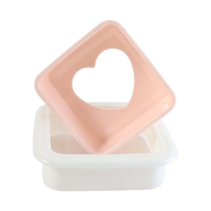 Heart-shaped sandwich cutter and bread press by Wukusy, made of plastic, ideal for creating fun sandwiches at home.