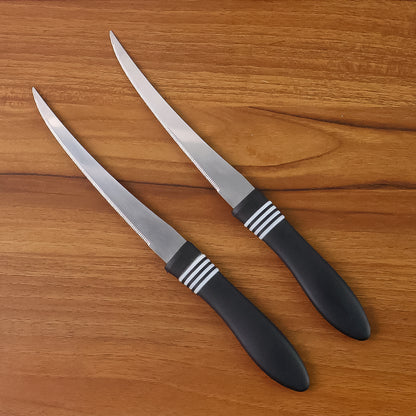 Wukusy premium curved serrated stainless steel kitchen knife set with two colorful knives on a wooden cutting board.
