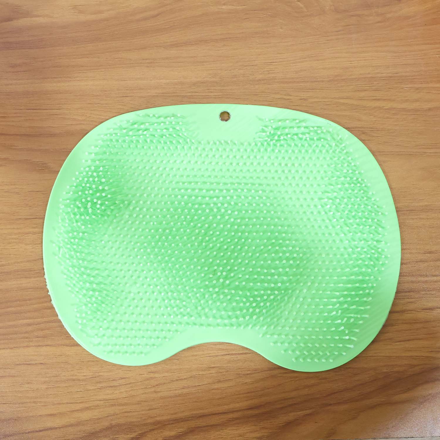 Purple silicone bath massage cushion with suction cups and exfoliating foot scrubber mat by Wukusy for relaxing bath routines.