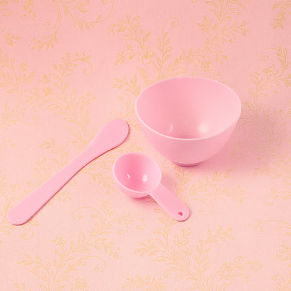 Two white facial mask mixing bowls with wooden spatulas in a 3-piece Wukusy set, placed on a neutral surface.