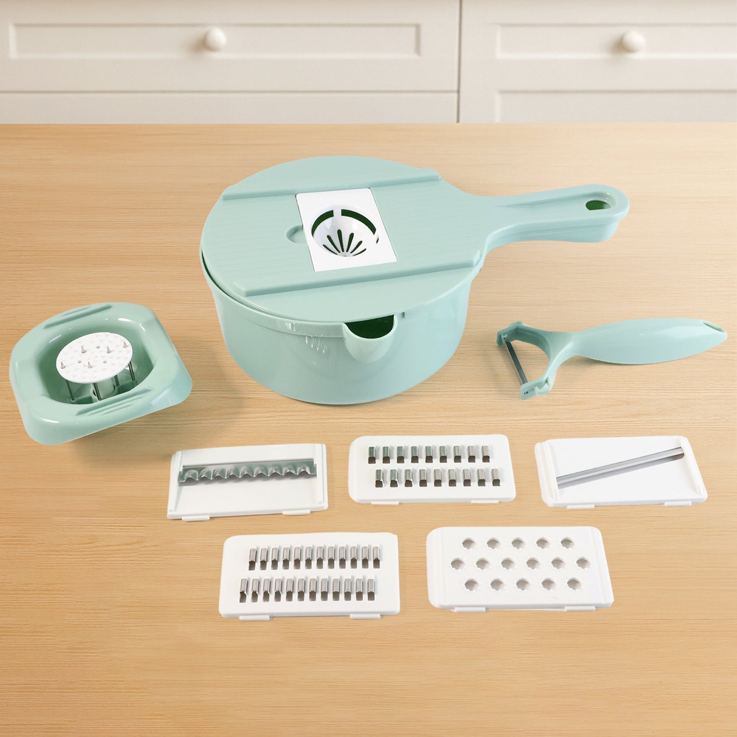 Wukusy multi-function vegetable cutter and grater set with various blades for slicing, shredding, and grating vegetables.