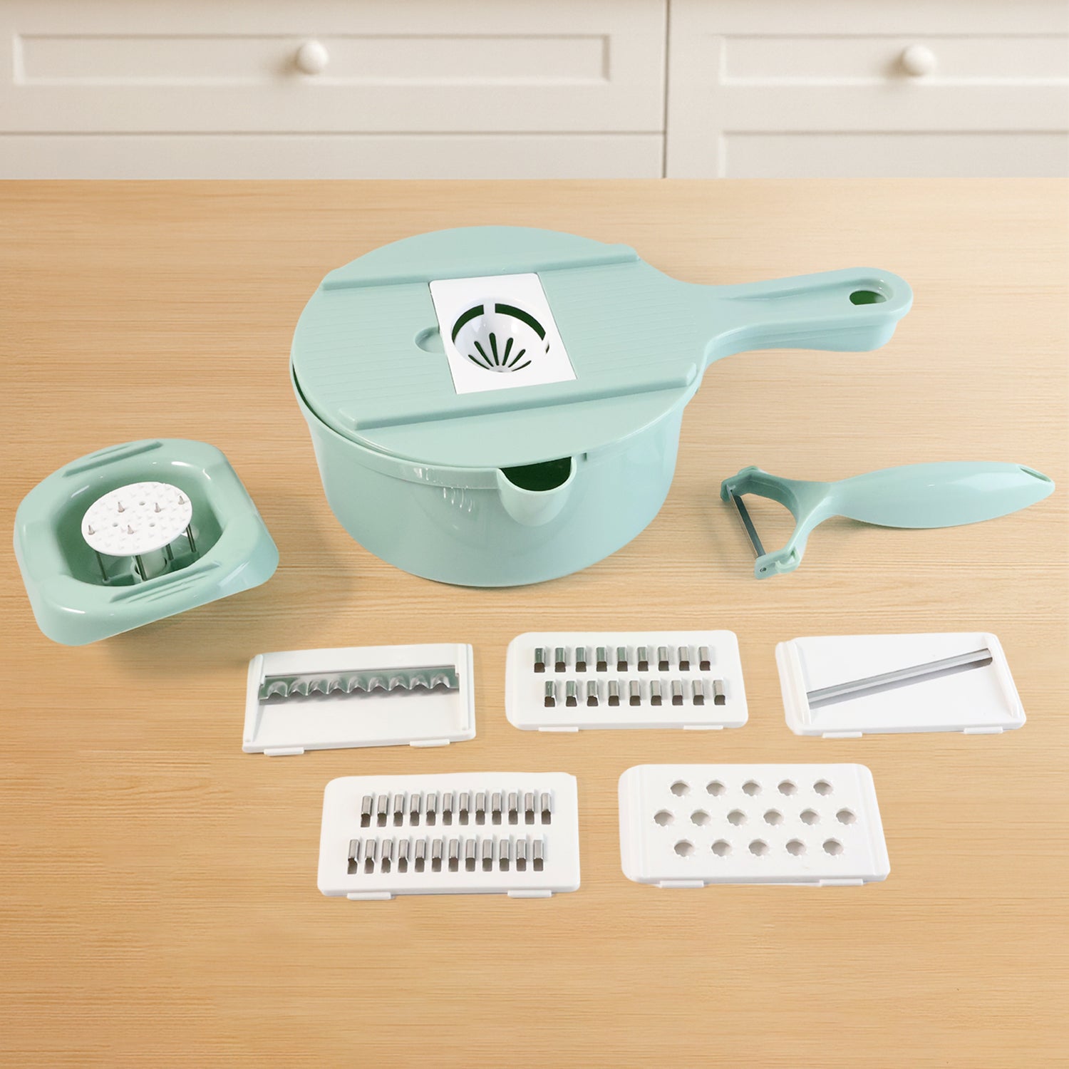 Wukusy multi-function vegetable cutter and grater set with various blades for slicing, shredding, and grating vegetables.