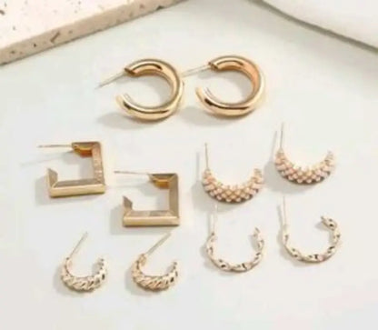 Set of 17 girls' metal stud earrings, including various designs, from Ekom jewelry collection displayed in the image.