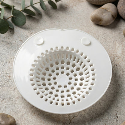 Flexible silicone sink drain strainer from Wukusy, showing a close-up of the bright red, flexible, mesh filter with a sleek design.