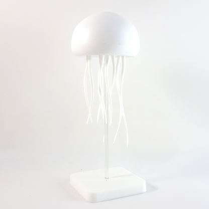 Wukusy jellyfish shape LED mood light lamp with glowing tentacles in a dark room, creating a calming, underwater ambiance.