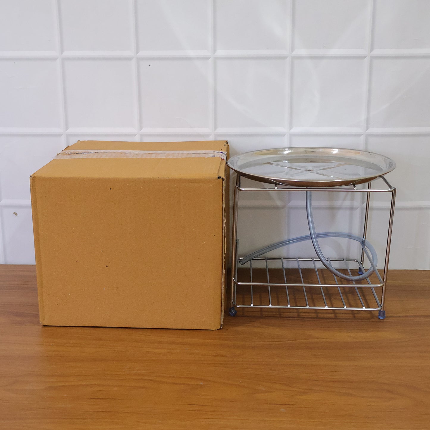 Stainless steel multipurpose utensils stand by Wukusy holding cooking spoons, spatulas, and kitchen tools in a modern kitchen setting.