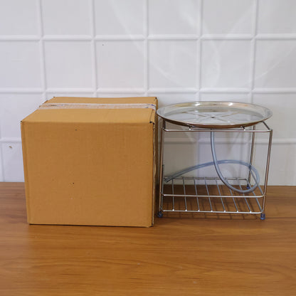 Stainless steel multipurpose utensils stand by Wukusy holding cooking spoons, spatulas, and kitchen tools in a modern kitchen setting.