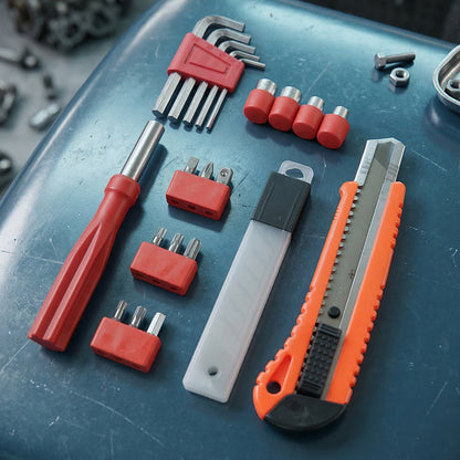 Wukusy professional screwdriver tool set with various screwdrivers, bits, and handles arranged on a workbench for versatile repair tasks.