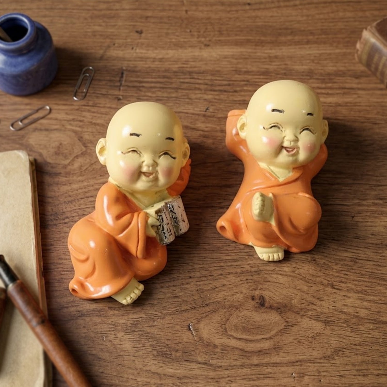 Set of 8 mini Buddha monk idols by Wukusy, featuring small, detailed resin sculptures with serene expressions and traditional robes.