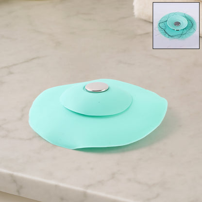 Creative 2-in-1 light green silicone sewer sink sealer cover and drainer for kitchen sinks, by Wukusy, with multicolour accents.