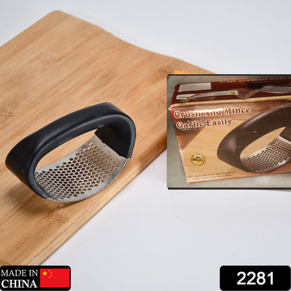 Multicolor stainless steel garlic presser crusher by Wukusy, showing the ergonomic handle and stainless steel pressing mechanism.