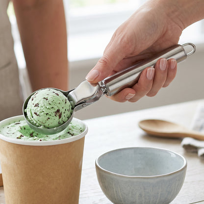 Wukusy stainless steel trigger release ice cream scoop and cookie dough scooper with ergonomic handle for easy portioning.