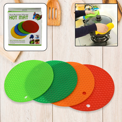 Wukusy 4-piece silicone hot mat set for placing hot vessels and utensils, protects surfaces without leaving marks.