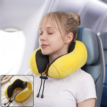 Yellow plush U-shaped travel neck pillow with drawstring from Wukusy, designed for soft neck support during travel.