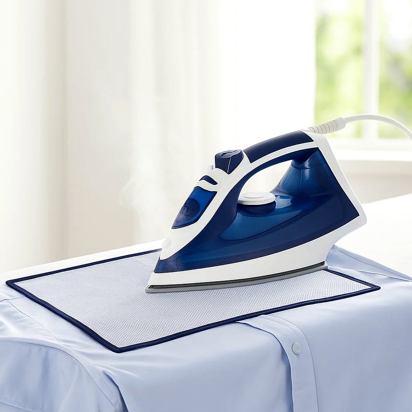 Wukusy heat-resistant ironing mesh press cloth, 65x40 cm, protecting fabrics during ironing in the image.