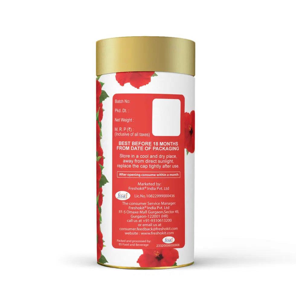Freshville Hibiscus Tea in a ceramic tea pot, showcasing vibrant red hibiscus flowers and brewing tea.