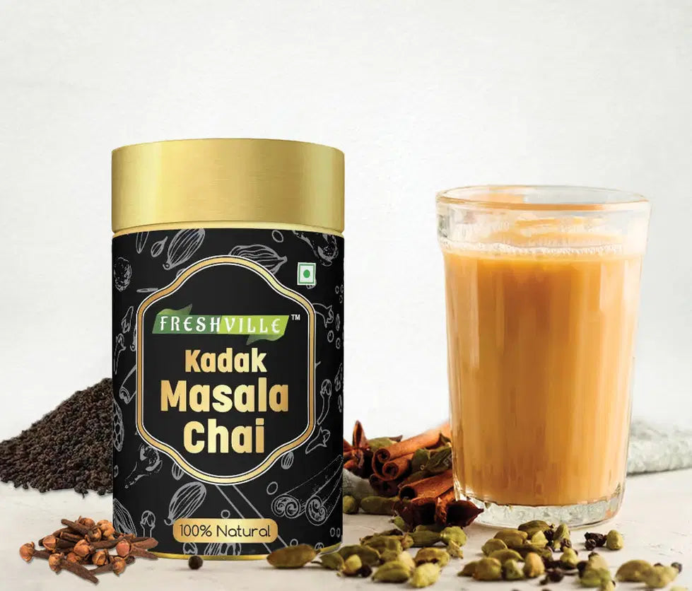 Tea pot with Freshville Kadak Masala Tea 100g, featuring traditional design and vibrant colors, ideal for brewing flavorful tea.