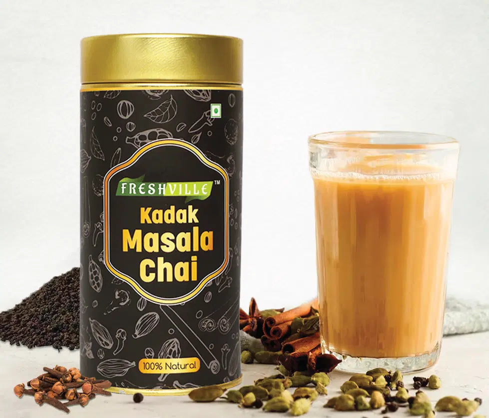 Freshville Kadak Masala Tea in a tea pot, 200g, with vibrant packaging, showcasing the aromatic spices used in the tea.