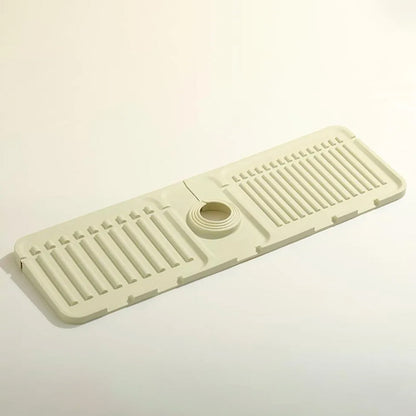 Wukusy 4914 silicone sink faucet pad drip protector and splash guard on kitchen countertop, rubber drying mat in use.
