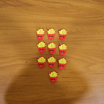 Set of 10 cute French fries-shaped bag charm keychains by Wukusy featuring playful, golden fry designs on a neutral background.