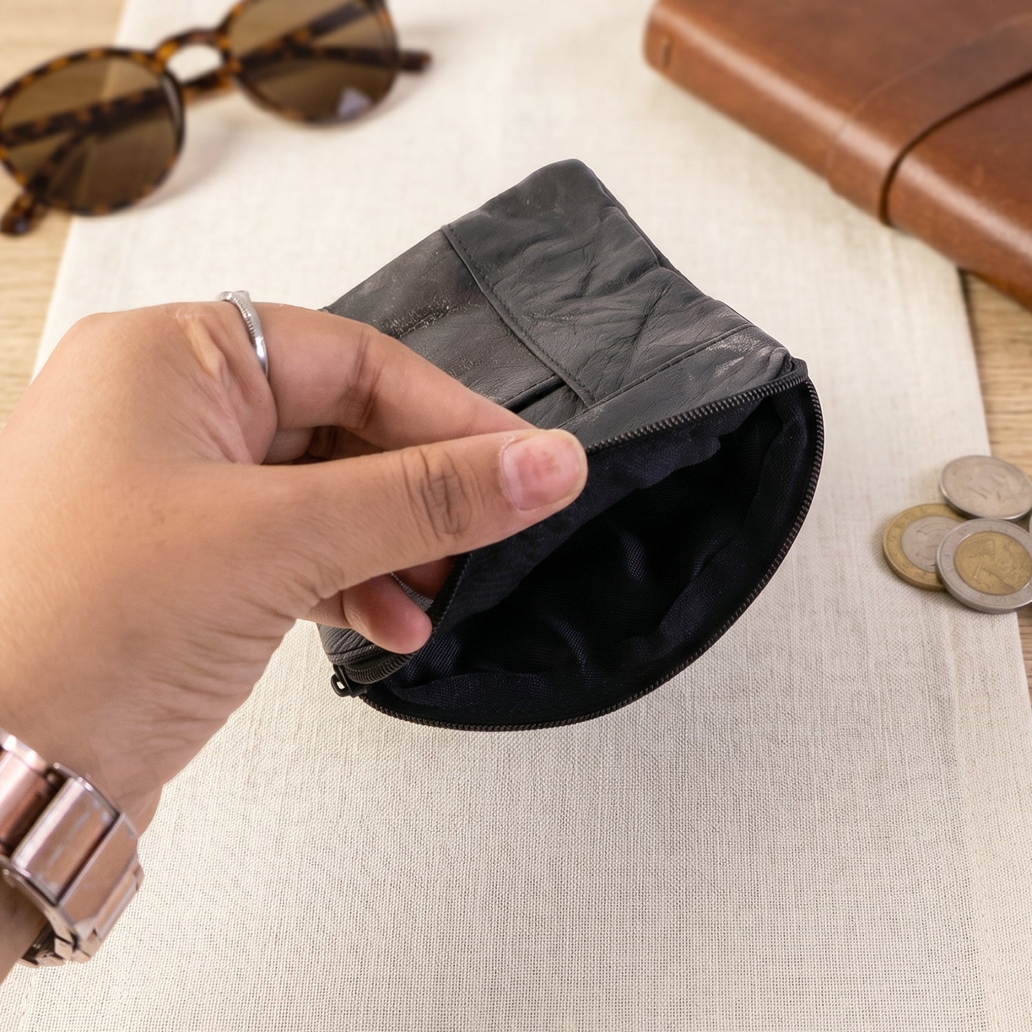 Wukusy leather mini zipper pouch for coins and cards, compact organizer for men and women with zip closure and sleek design.