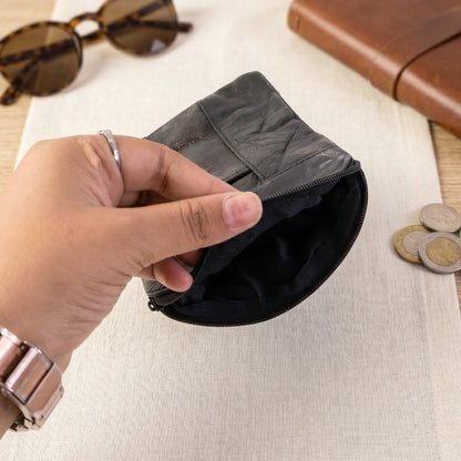 Wukusy leather mini zipper pouch for coins and cards, compact organizer for men and women with zip closure and sleek design.