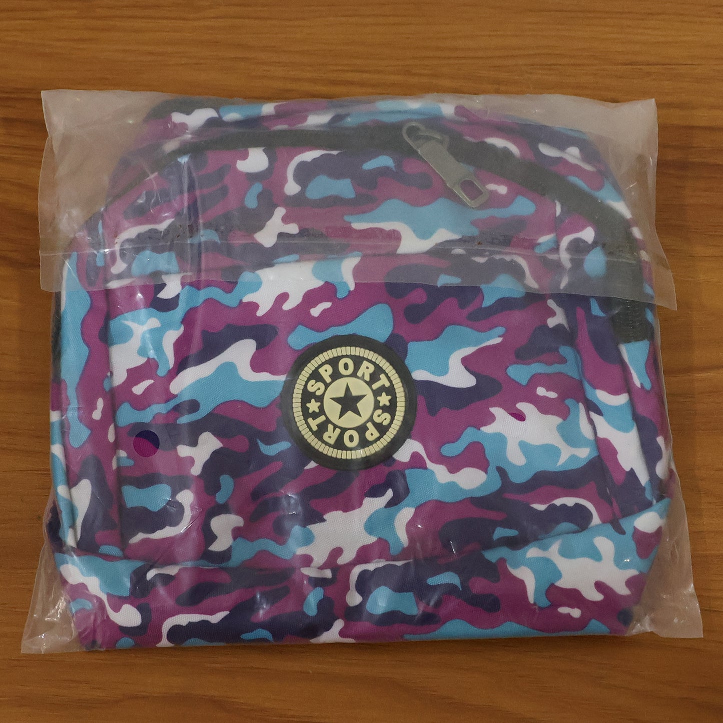 Camouflage print waist bag by Wukusy with adjustable strap, featuring multiple compartments for convenient carrying.