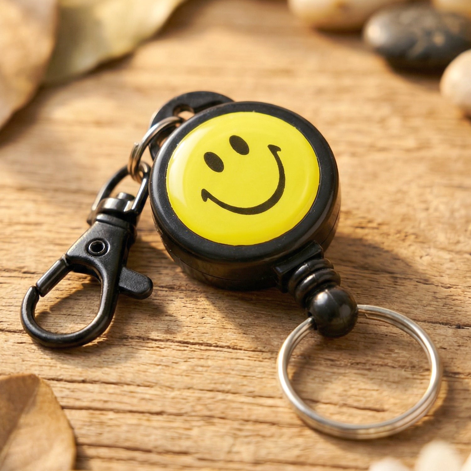 Wukusy smiley face retractable keychain with colorful design, featuring a cheerful cartoon face and a sturdy retractable cord.