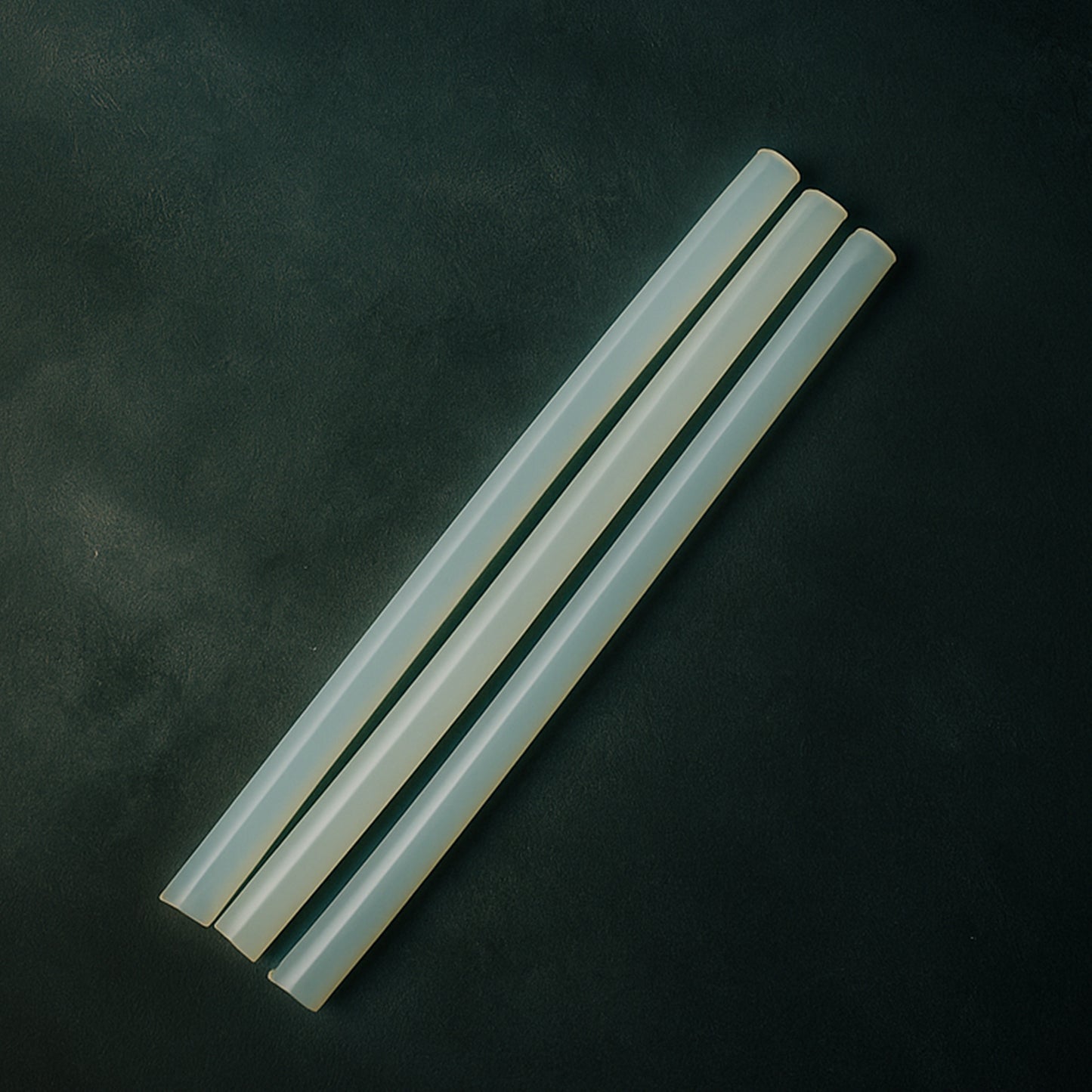 Wukusy hot melt glue sticks for glue guns, 20 cm long, suitable for home improvement projects, shown in a close-up image.