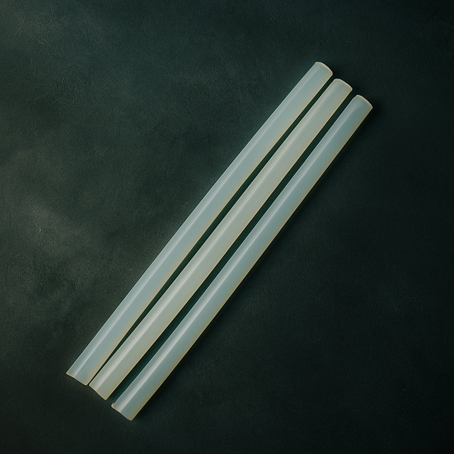Wukusy hot melt glue sticks for glue guns, 20 cm long, suitable for home improvement projects, shown in a close-up image.