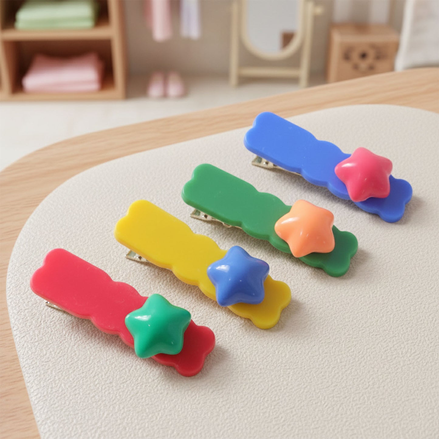 Set of four colorful star-shaped decorative hair clips by Wukusy, shown on a plain background.