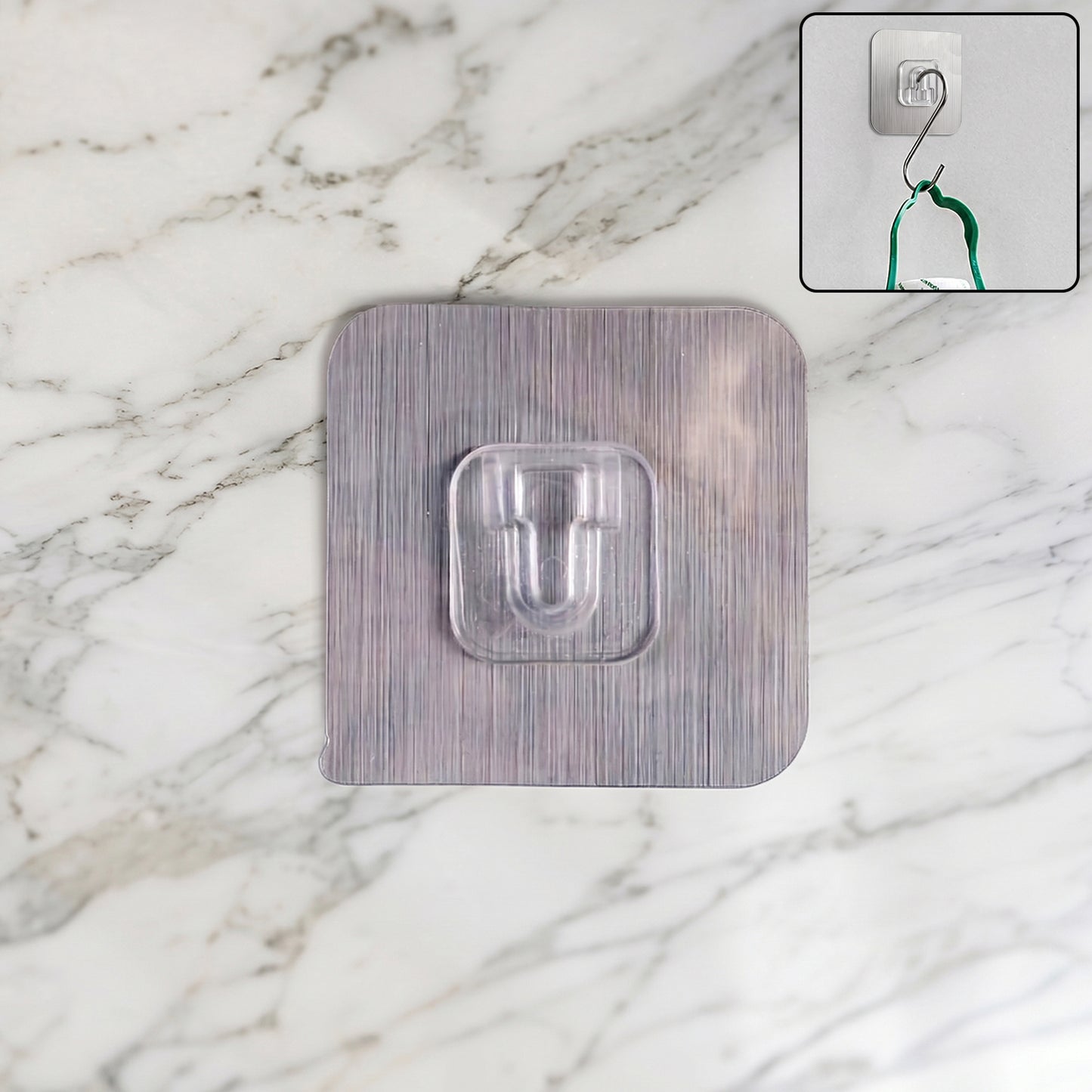 Heavy duty Wukusy self-adhesive utility wall hook attached to a wall, holding tools and household items.