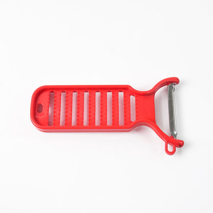Wukusy Supermom ginger grater and peeler in a white plastic kitchen tool with handle, designed for grating and peeling ginger.