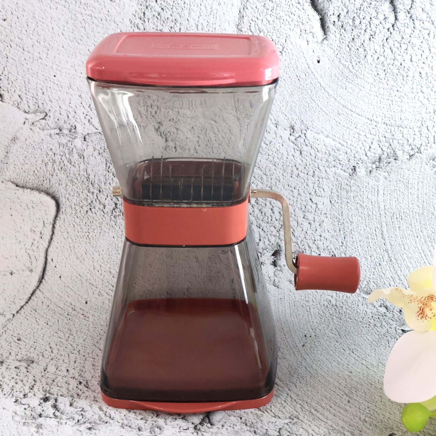 Wukusy Supermom manual cutter with blades and locking lid, kitchen tool for precise food cutting and safety in home kitchen.