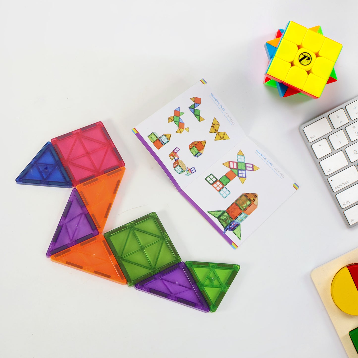 Wukusy magnetic building tiles, 26-piece toy set with colorful square and triangle pieces for creative construction and play.