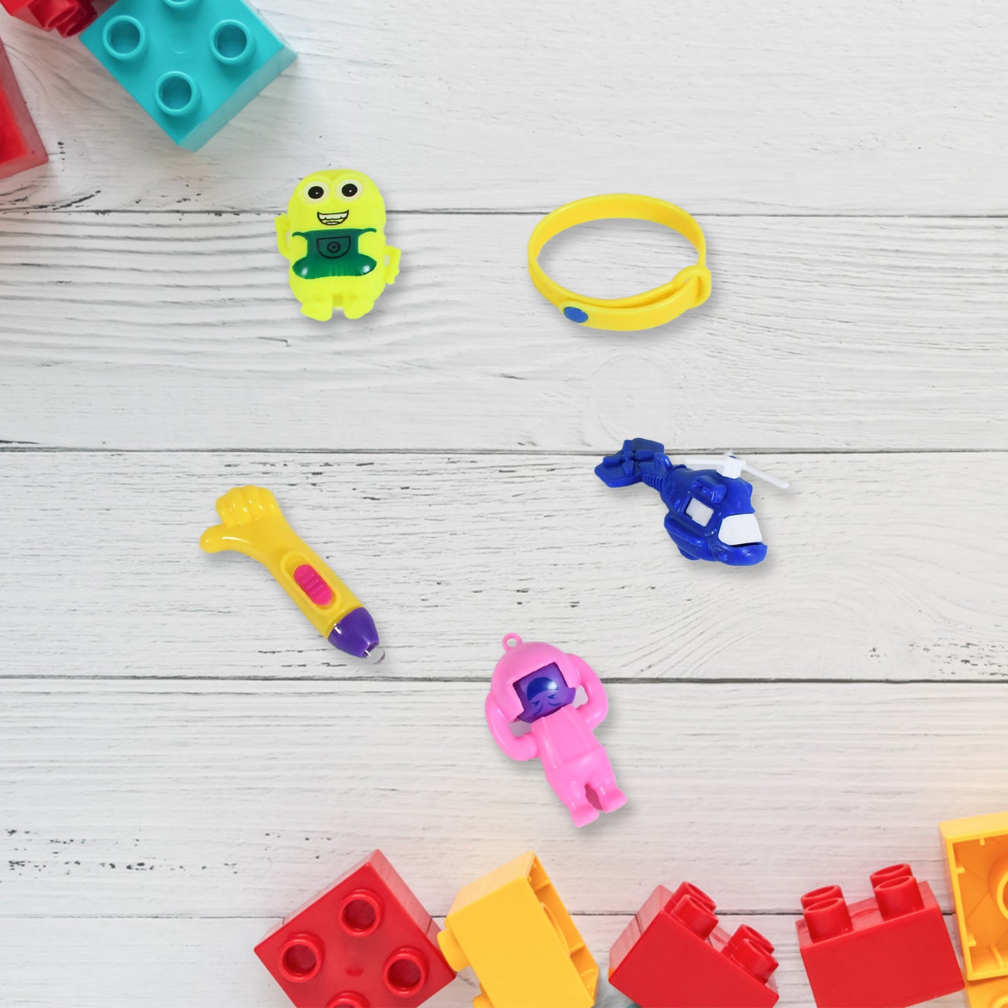 Colorful Wukusy 5-piece toy combo set for kids with a potli bag, featuring attractive and unique toy designs perfect for gifting.