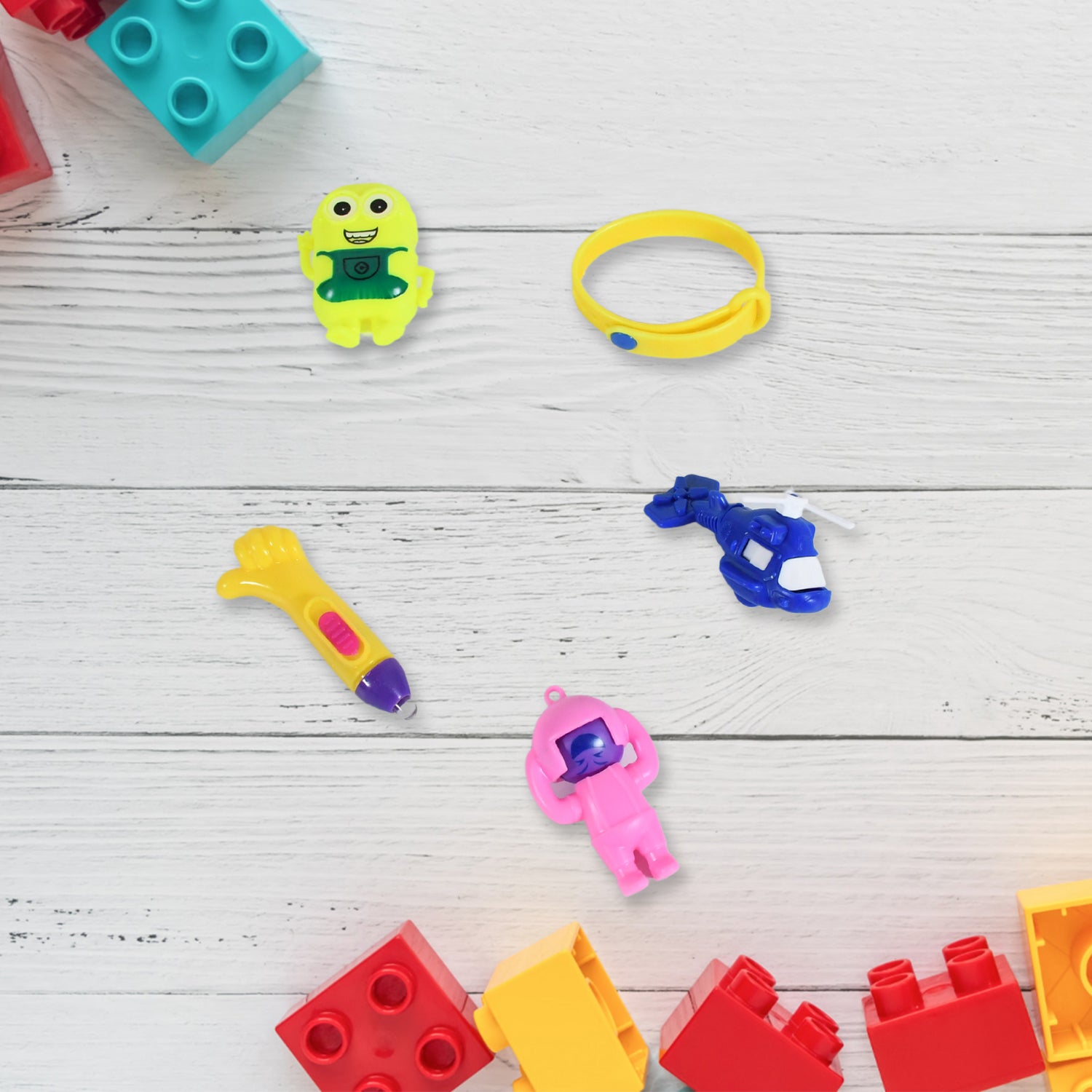 Colorful Wukusy 5-piece toy combo set for kids with a potli bag, featuring attractive and unique toy designs perfect for gifting.