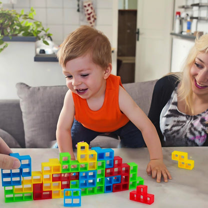 Wukusy Tumble Tower balancing blocks game set with colorful wooden pieces stacked in a tower on a white background.