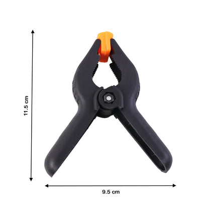 Wukusy heavy-duty spring clamp with red handles, sturdy metal construction, used for holding materials securely in place.