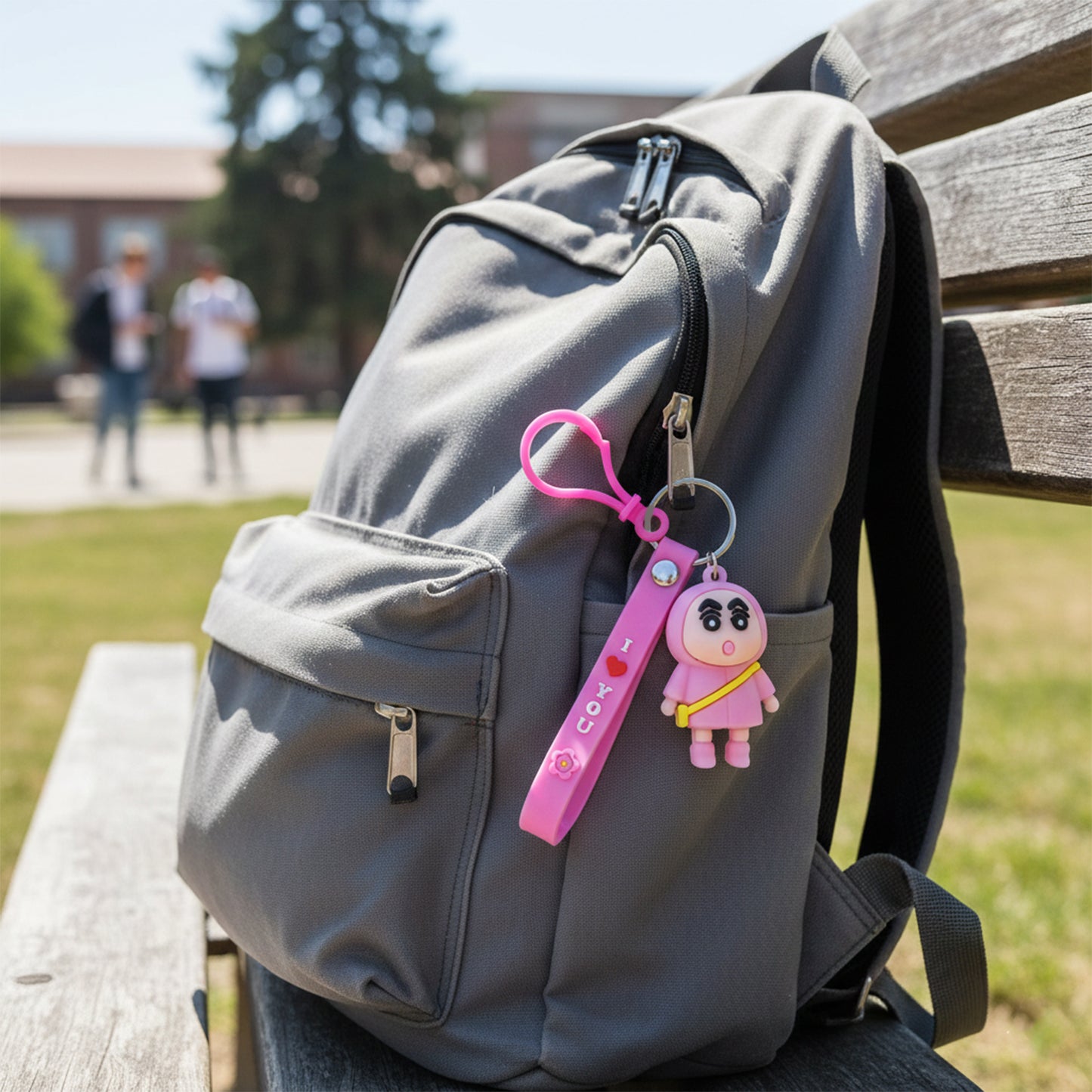Cute cartoon doll figure keychain by Wukusy featuring a colorful, smiling character with a loop for attaching to keys or bags.