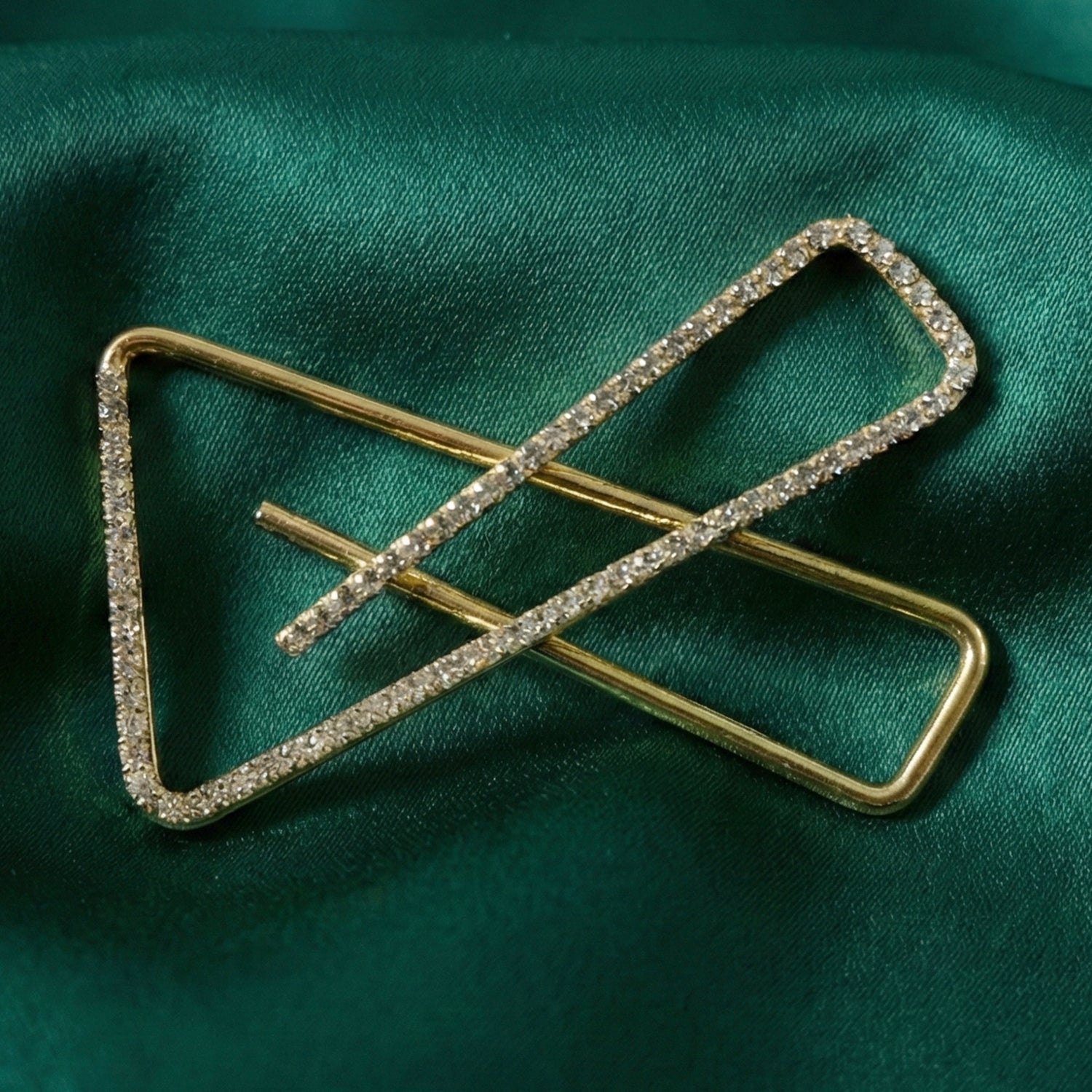 Golden crystal triangle saree safety pin brooch with intricate design, perfect for traditional Indian attire by Wukusy.