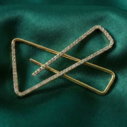 Golden crystal triangle saree safety pin brooch with intricate design, perfect for traditional Indian attire by Wukusy.