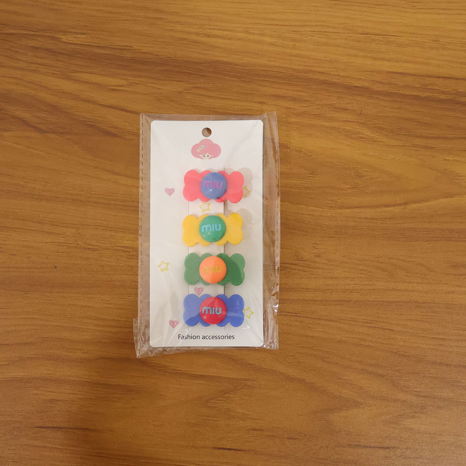 Colorful candy-shaped hair clips by Wukusy, featuring vibrant, playful designs perfect for children's or fun hairstyles.