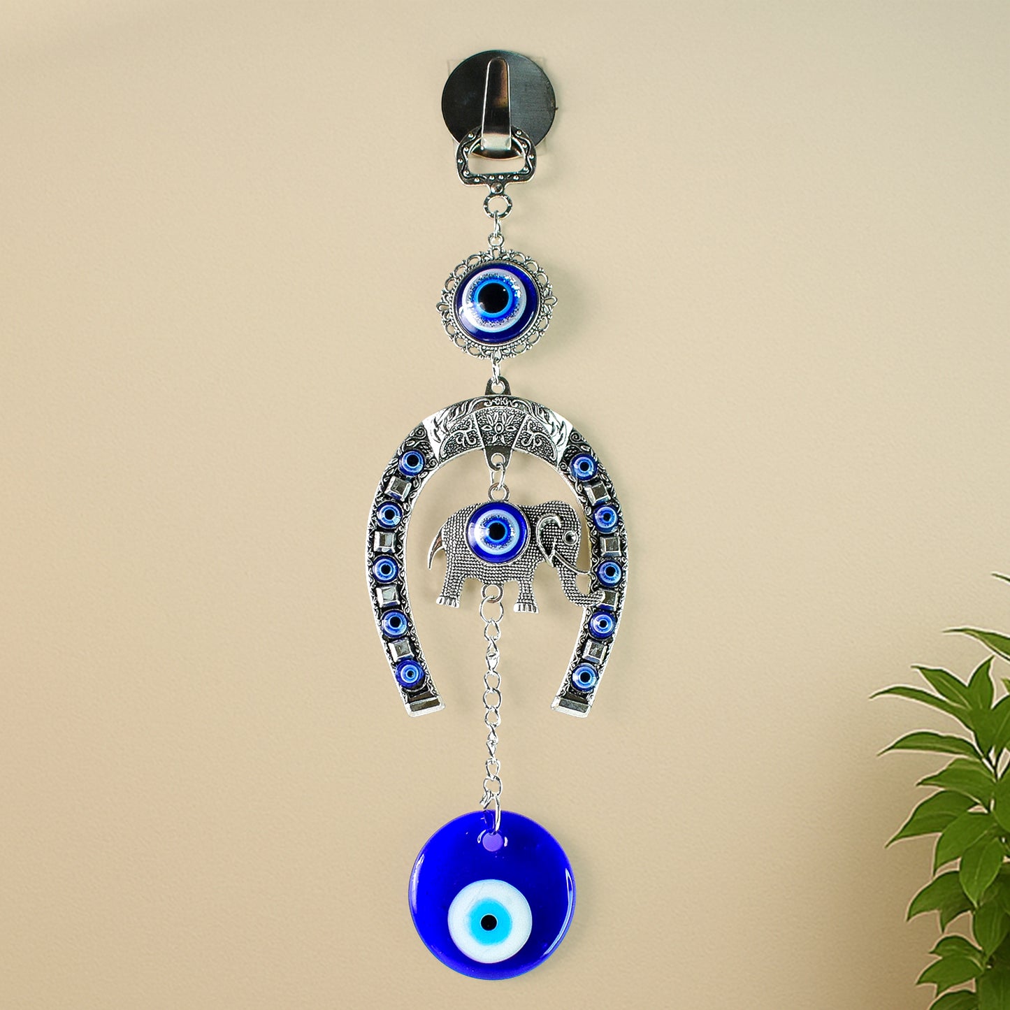 Decorative evil eye wind chime with elephant and horseshoe motifs, hanging ornament by Wukusy, featuring colorful glass beads and charms.