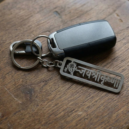 Premium metal Jay Shri Krishna engraved keychain by Wukusy, featuring intricate Krishna design and craftsmanship.