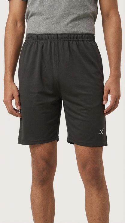 Men's Dropdash running tights paired with sandals and floaters, showcasing athletic apparel and casual footwear.